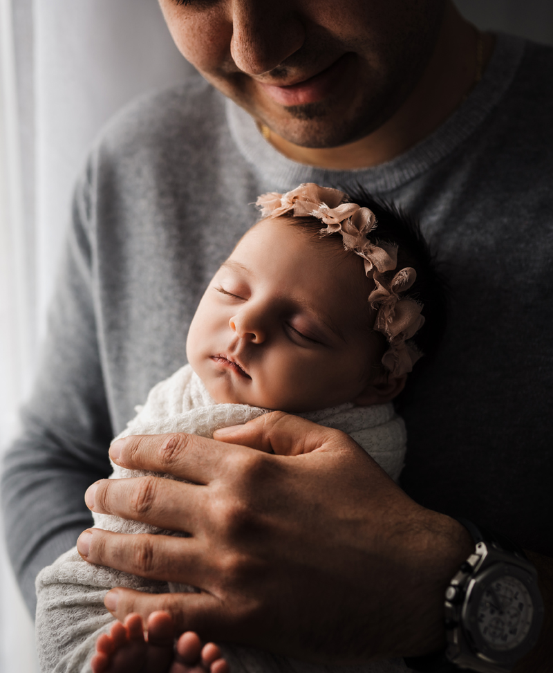 Newborn Photography, baby girl sleeping on father chest